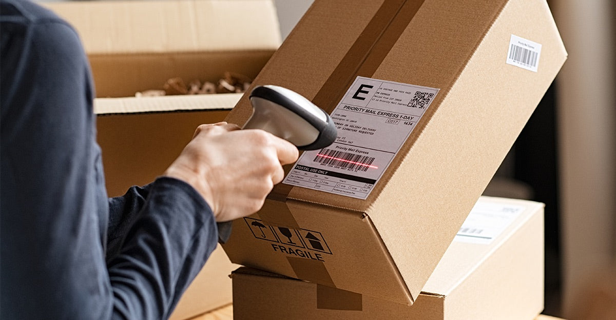 Shipping label being scanned on package